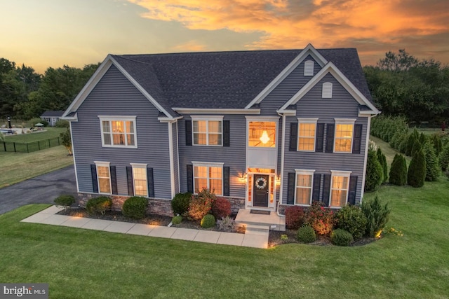 view of front of home with a lawn