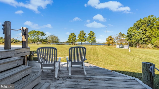 deck with a yard and a gazebo