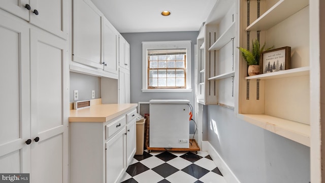 washroom featuring cabinets