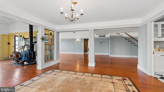 interior space with hardwood / wood-style flooring and an inviting chandelier