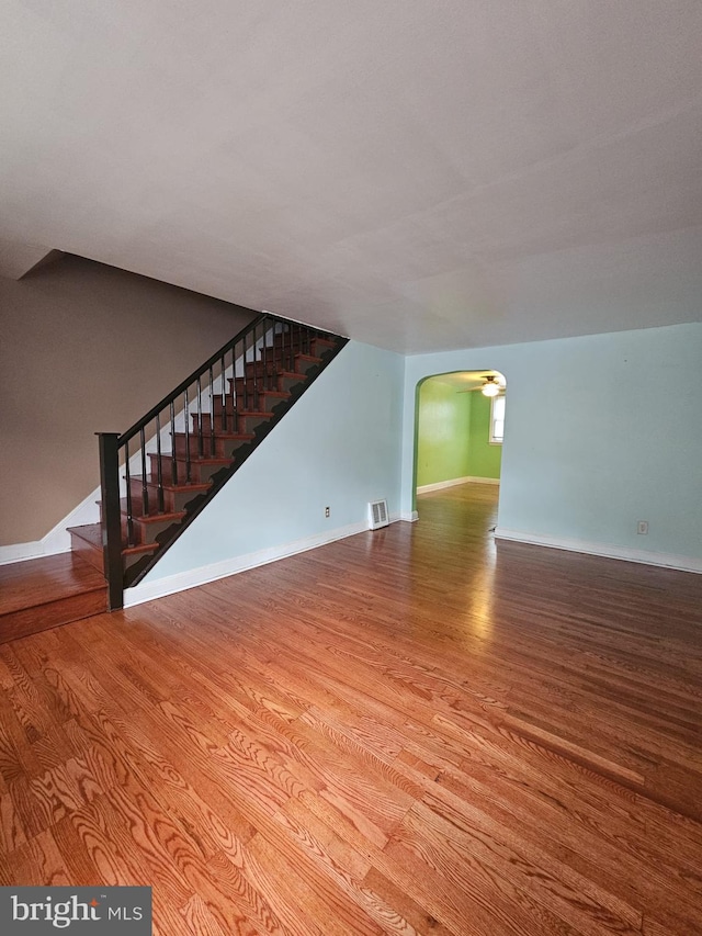 unfurnished living room featuring wood-type flooring