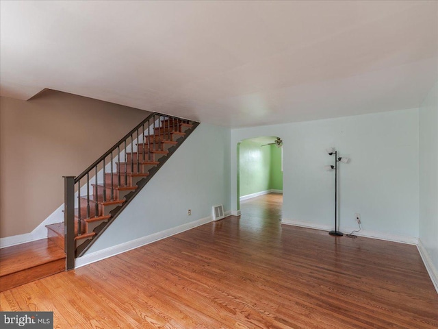 unfurnished living room featuring wood-type flooring