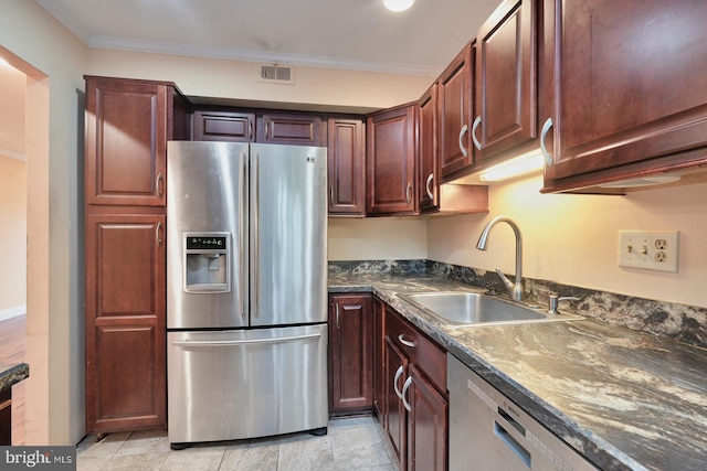 kitchen with sink, appliances with stainless steel finishes, ornamental molding, and light tile patterned flooring