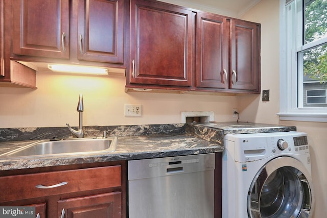 laundry area with ornamental molding, sink, and washer / dryer