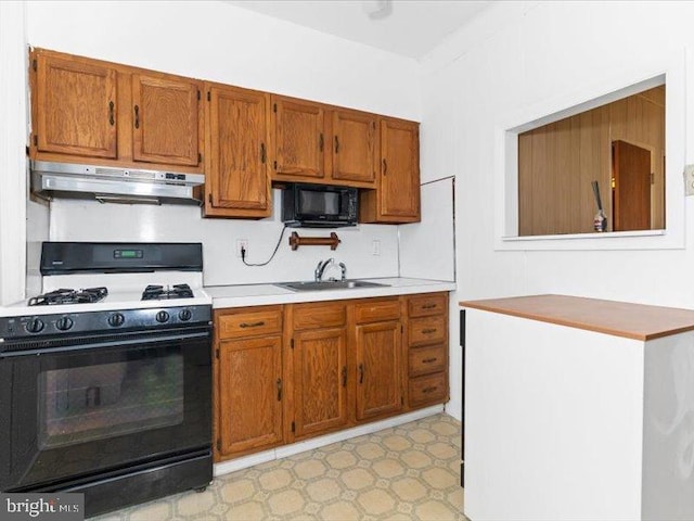 kitchen with sink and black appliances