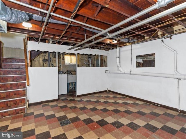 basement with washer / clothes dryer and sink