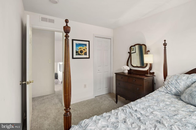 bedroom featuring light carpet and a closet