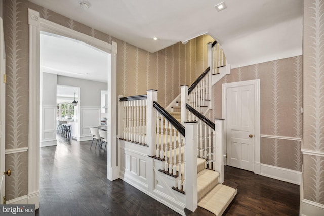 staircase featuring hardwood / wood-style flooring