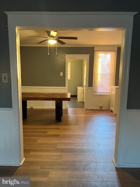 interior space with wood-type flooring and ornamental molding