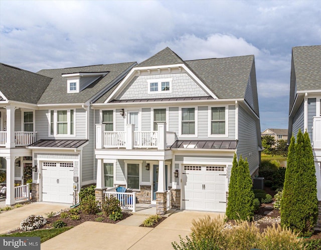 view of front of home featuring cooling unit and a garage