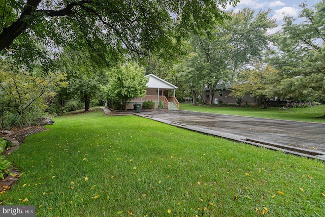 view of yard with a wooden deck