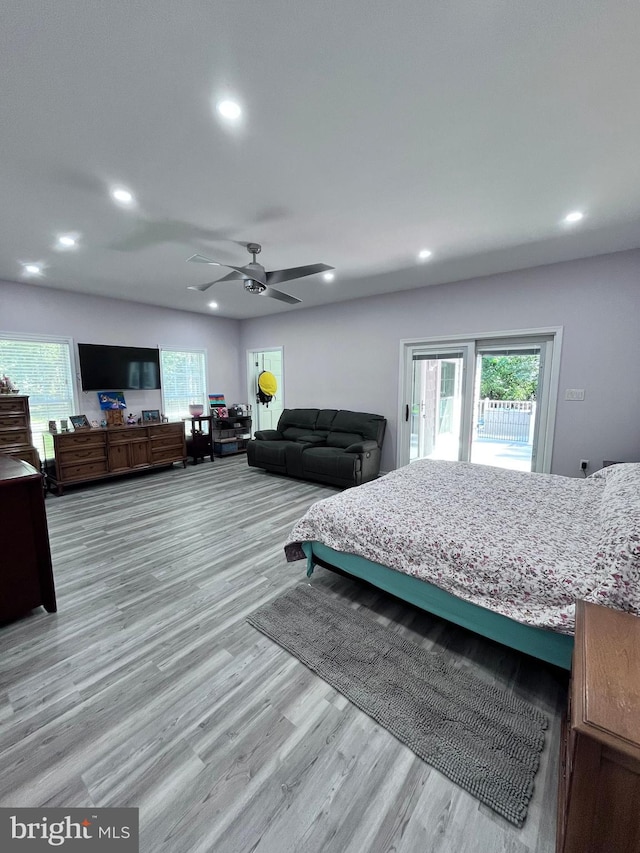 bedroom featuring light wood-type flooring, ceiling fan, and access to exterior