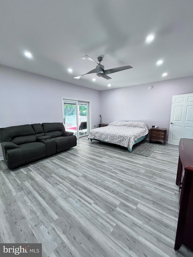 bedroom featuring light hardwood / wood-style floors and ceiling fan