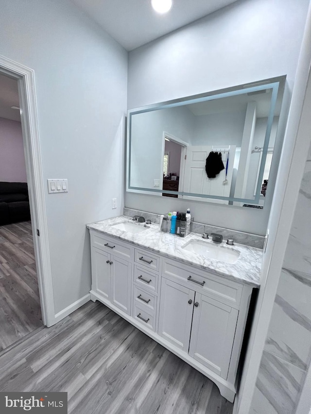 bathroom featuring wood-type flooring and vanity