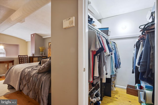 walk in closet featuring light hardwood / wood-style flooring