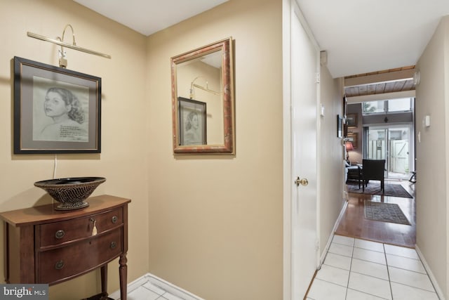 corridor with light hardwood / wood-style floors