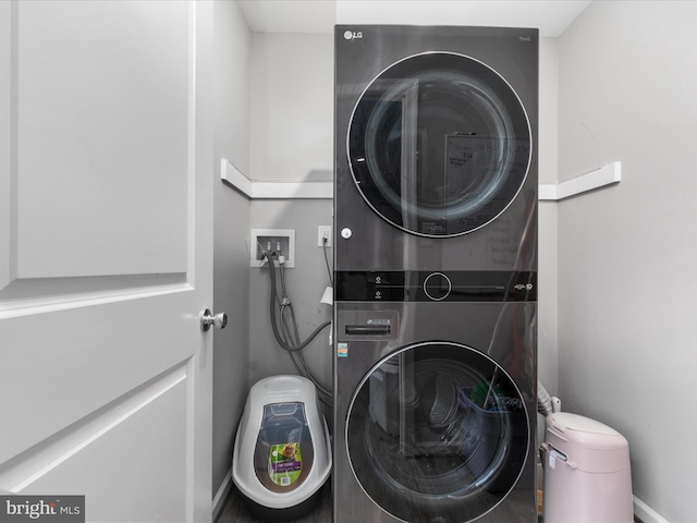 laundry room with stacked washer and dryer