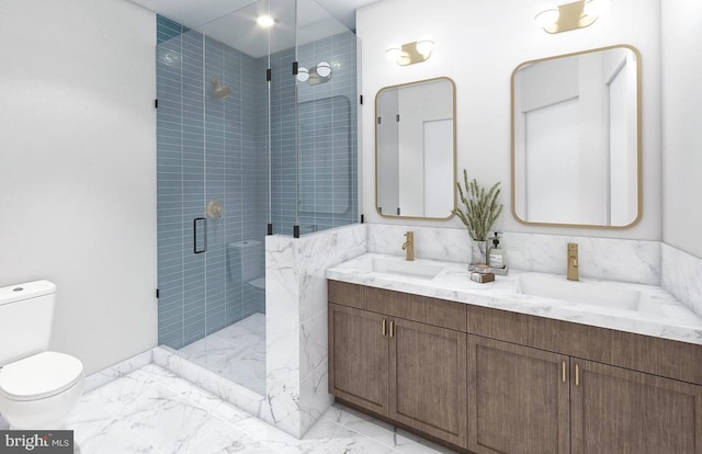 bathroom with vanity, toilet, and a shower with shower door