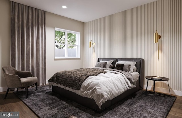 bedroom with dark hardwood / wood-style flooring