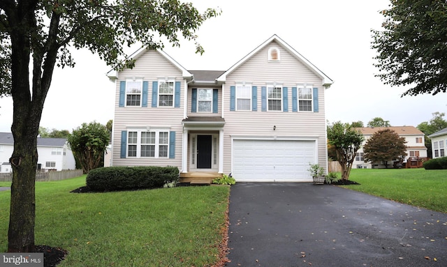 view of front of home featuring a garage and a front yard