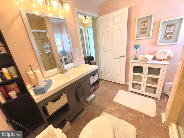 bathroom with vanity, tile patterned flooring, and a shower with door