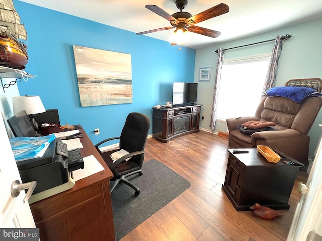 office space featuring ceiling fan and light hardwood / wood-style flooring