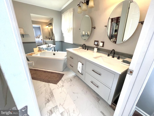 bathroom featuring a tub and vanity