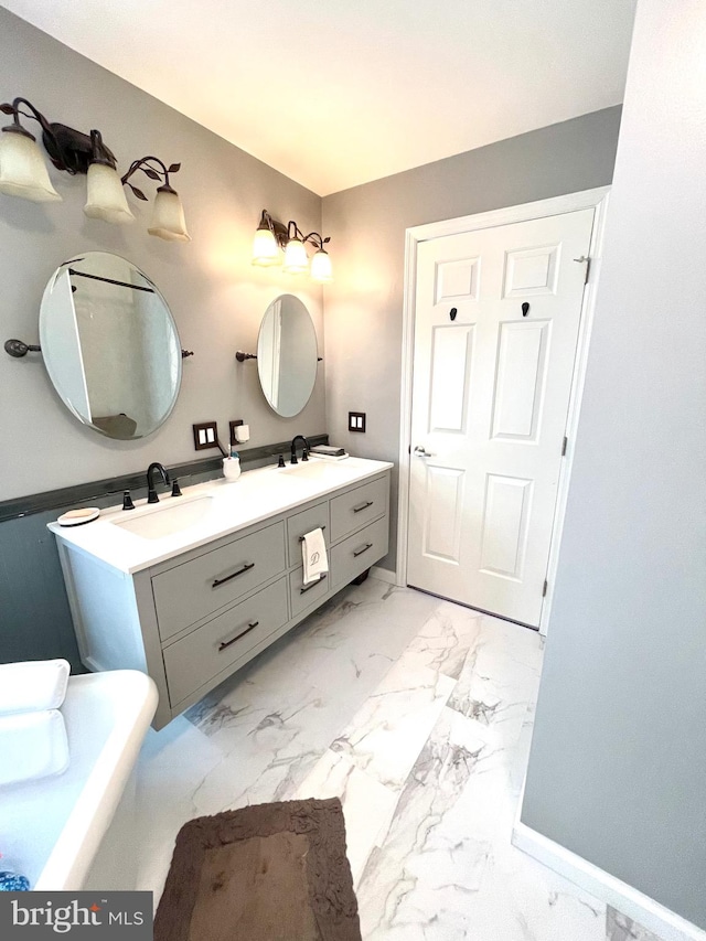 bathroom with a bathtub and vanity