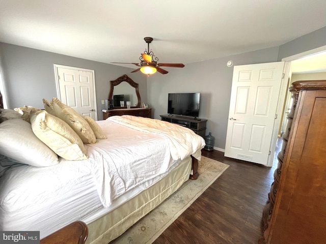 bedroom featuring dark hardwood / wood-style flooring and ceiling fan