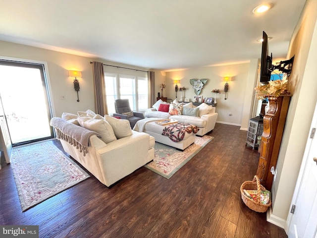 bedroom with access to outside and dark hardwood / wood-style floors