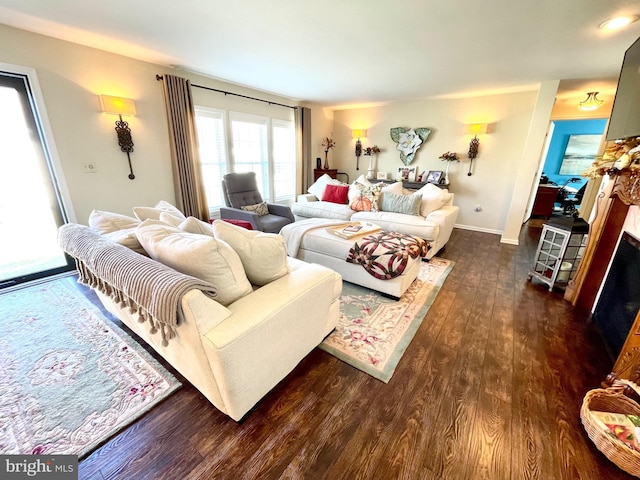 living room with dark hardwood / wood-style floors