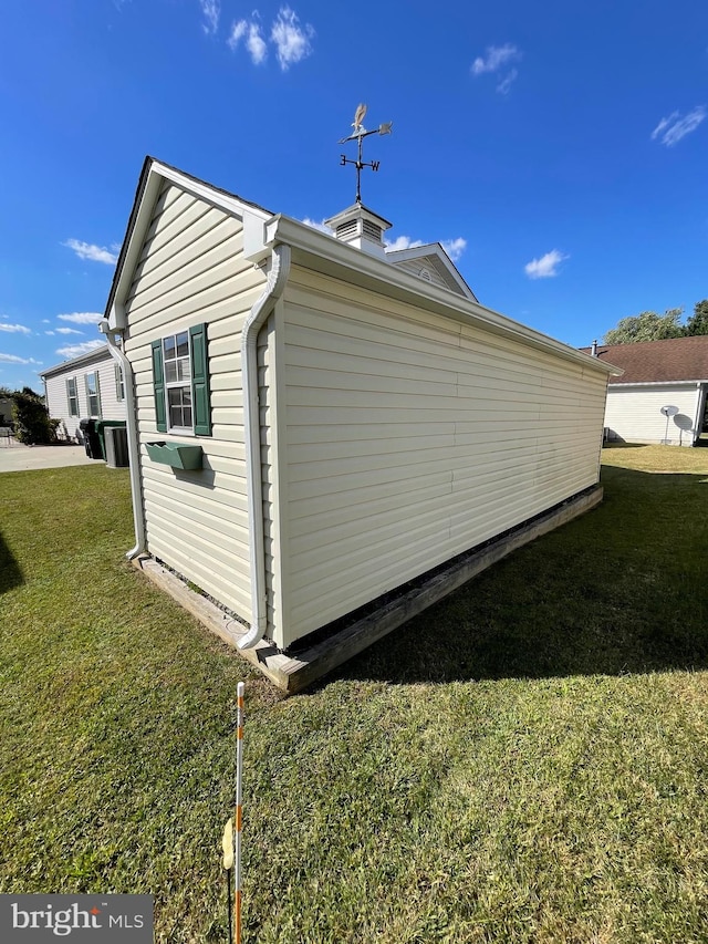 view of home's exterior featuring a lawn