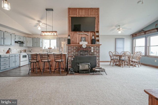 kitchen featuring gray cabinets, vaulted ceiling, ceiling fan, and white range with electric cooktop