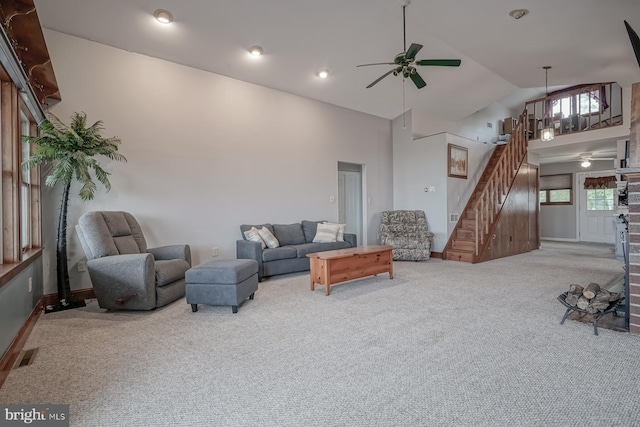 living room featuring high vaulted ceiling, ceiling fan, and carpet floors