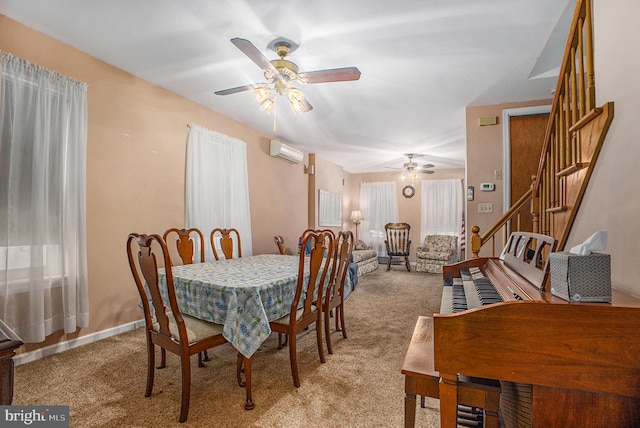 carpeted dining area with ceiling fan and a wall mounted air conditioner