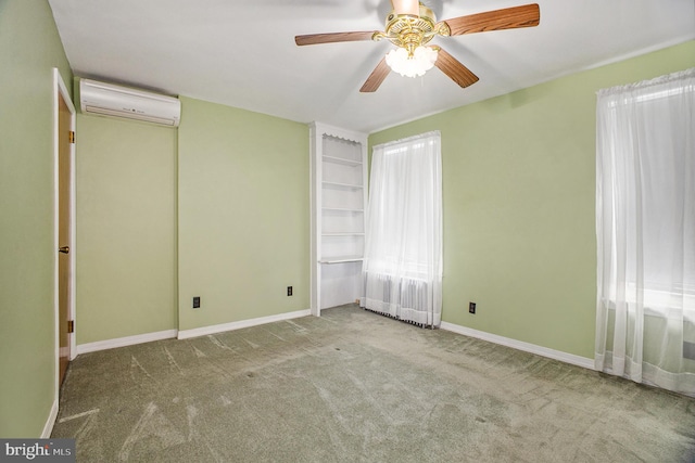 unfurnished bedroom with light colored carpet, an AC wall unit, and ceiling fan