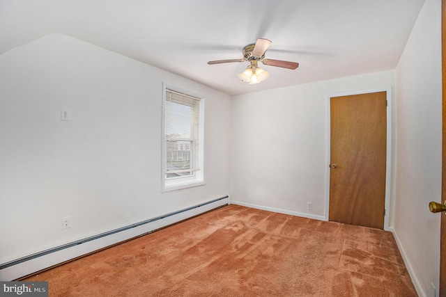 carpeted empty room featuring ceiling fan and a baseboard radiator