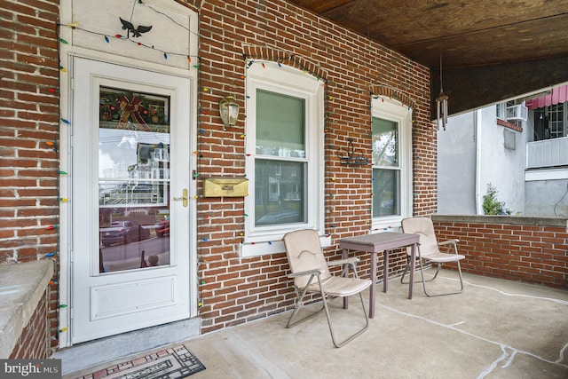 view of exterior entry with covered porch