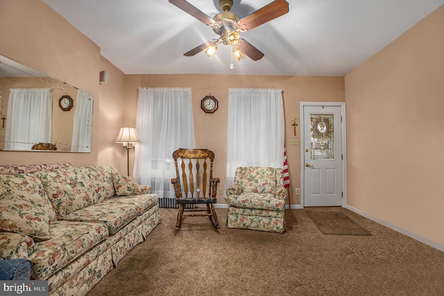 carpeted living room featuring ceiling fan