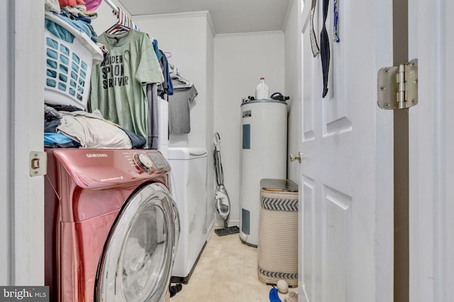 washroom with washer and clothes dryer, electric water heater, and ornamental molding