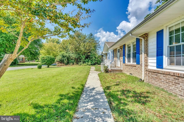 view of yard featuring a porch