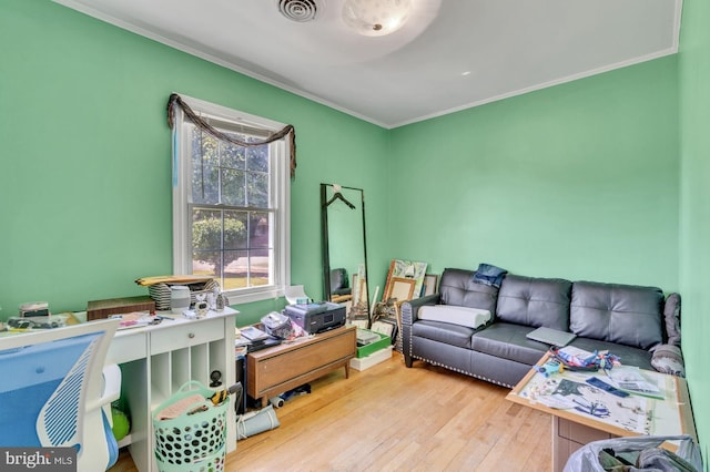 interior space featuring light hardwood / wood-style floors and ornamental molding