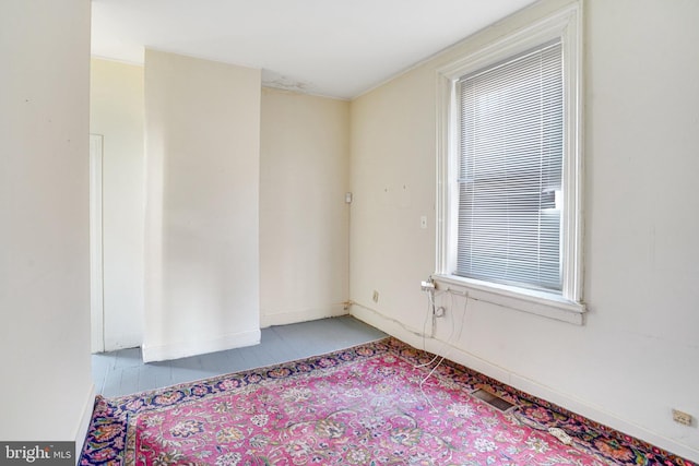 tiled empty room featuring a healthy amount of sunlight