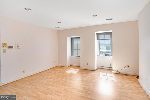 empty room with light hardwood / wood-style floors