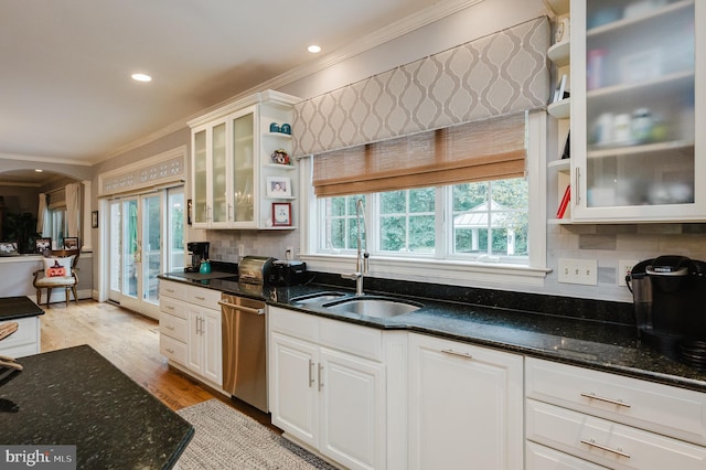 kitchen featuring white cabinetry, a wealth of natural light, and stainless steel dishwasher