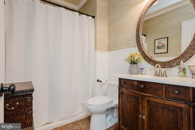 bathroom with vanity, toilet, crown molding, and walk in shower