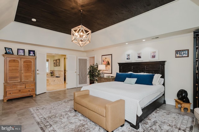 bedroom featuring a tray ceiling, ensuite bathroom, an inviting chandelier, and wooden ceiling