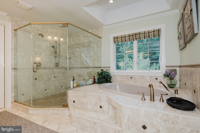 bathroom with ornamental molding and plus walk in shower