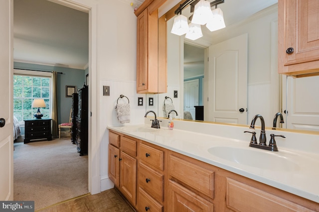 bathroom featuring vanity and ornamental molding