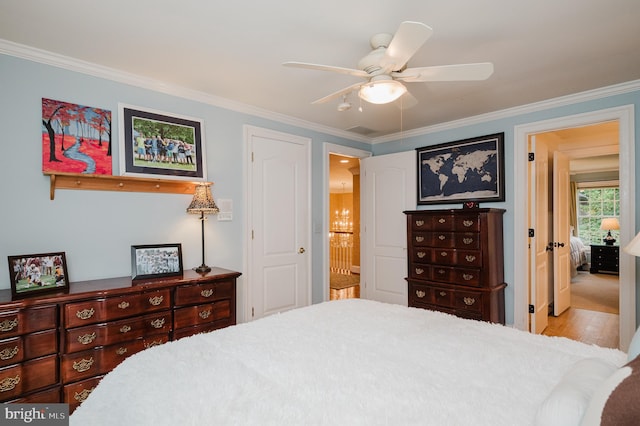 bedroom with light hardwood / wood-style floors, ornamental molding, ensuite bathroom, and ceiling fan